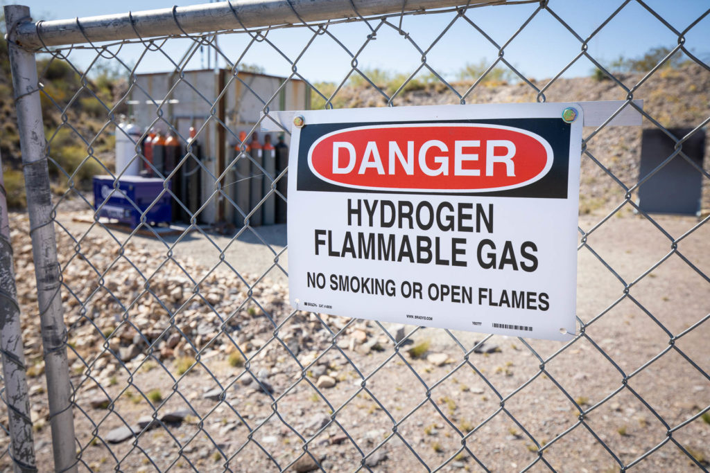 hydrogen flammability warning sign outside industrial facility